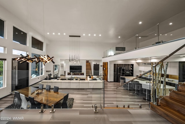 kitchen featuring a towering ceiling and open floor plan