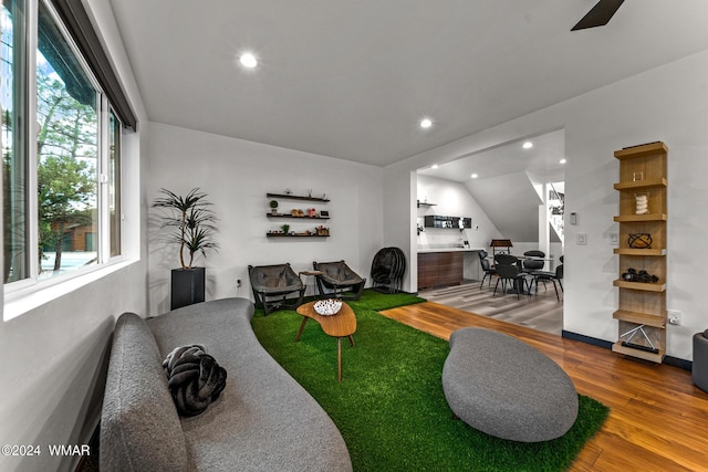 living room with recessed lighting and wood finished floors