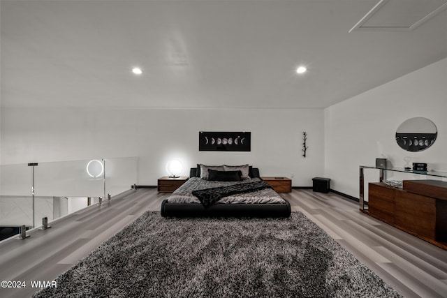 bedroom featuring recessed lighting, light wood-style flooring, and baseboards