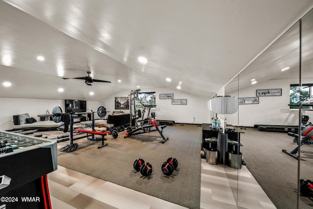 exercise room with vaulted ceiling, ceiling fan, light colored carpet, and recessed lighting