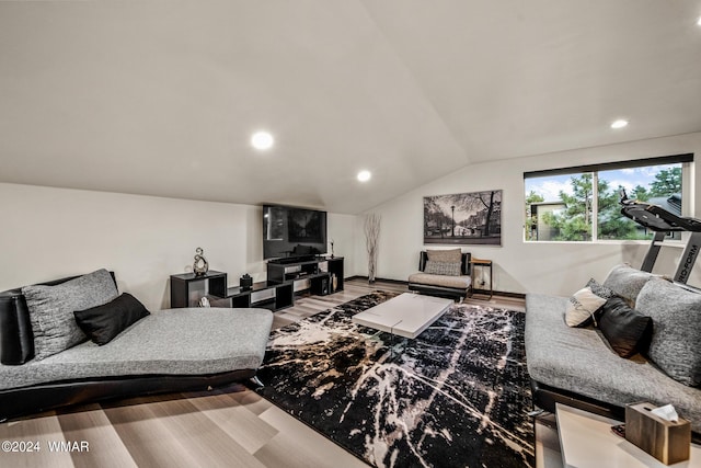 living area with lofted ceiling, wood finished floors, and recessed lighting