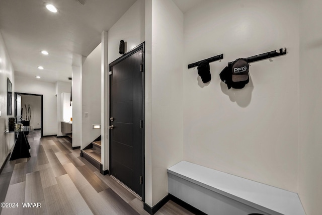 mudroom featuring recessed lighting, light wood-style flooring, and baseboards