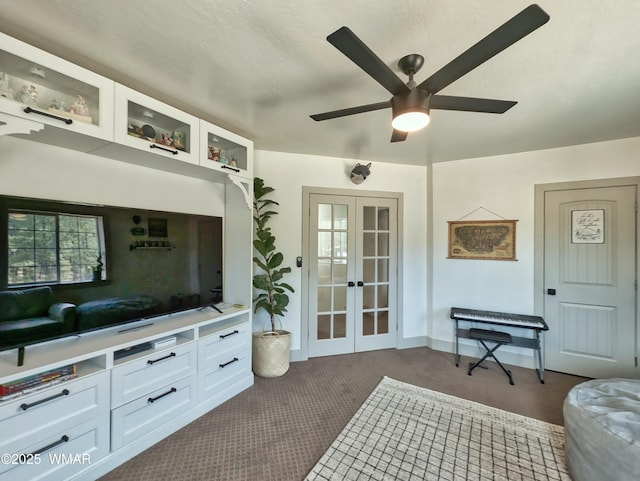 interior space with french doors, baseboards, and a ceiling fan