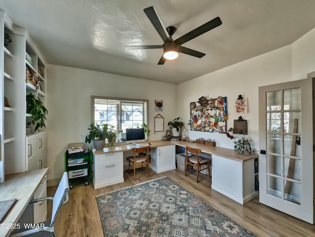 office space featuring light wood-style flooring and a ceiling fan