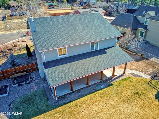 birds eye view of property with a residential view