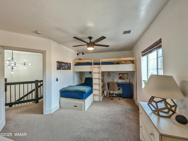 bedroom with visible vents, baseboards, an inviting chandelier, and carpet floors