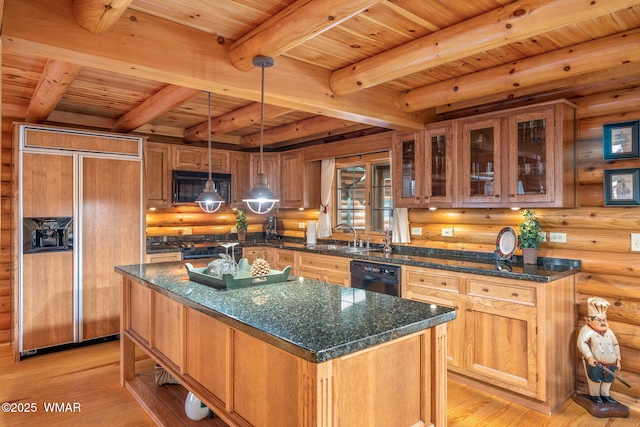 2677 Jackrabbit Dr, Pinetop, AZ 85935 - kitchen with brown cabinetry, dark stone counters, black appliances, and an island with sink