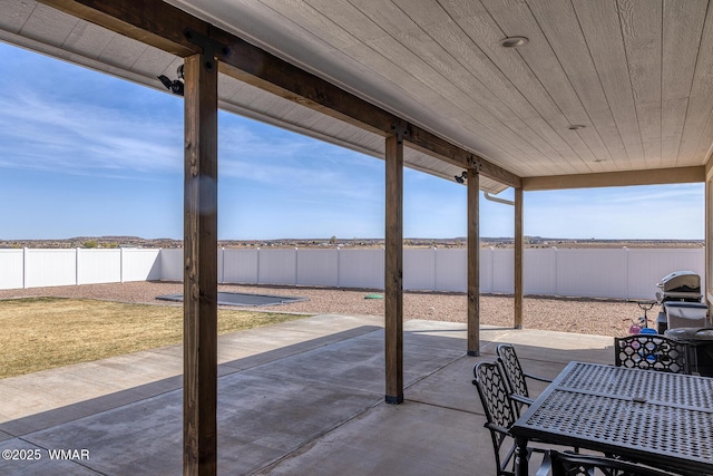 7758 James Pearce Way, Taylor, AZ 85939 - fenced backyard featuring a patio area and outdoor dining area