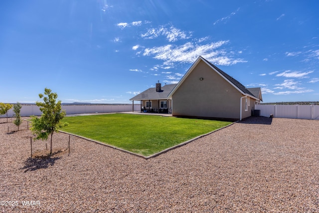 7758 James Pearce Way, Taylor, AZ 85939 - back of property with a fenced backyard, a patio, stucco siding, and a chimney