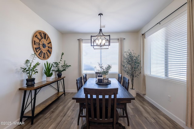 7758 James Pearce Way, Taylor, AZ 85939 - dining area with a chandelier and wood finished floors
