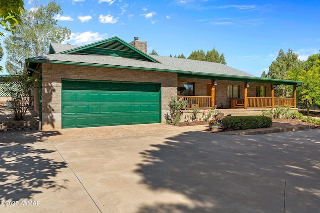 1030 Chamberlain Way, Show Low, AZ 85901 - view of front of home with driveway, covered porch, a chimney, and a garage