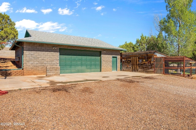 1030 Chamberlain Way, Show Low, AZ 85901 - view of side of home with a garage, an outbuilding, driveway, and a shingled roof