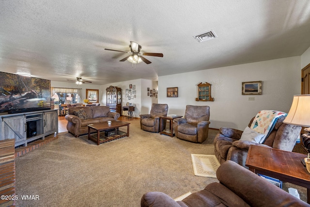 1030 Chamberlain Way, Show Low, AZ 85901 - living area featuring a ceiling fan, a textured ceiling, and carpet flooring