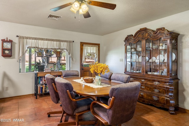 1030 Chamberlain Way, Show Low, AZ 85901 - tiled dining area with ceiling fan and baseboards
