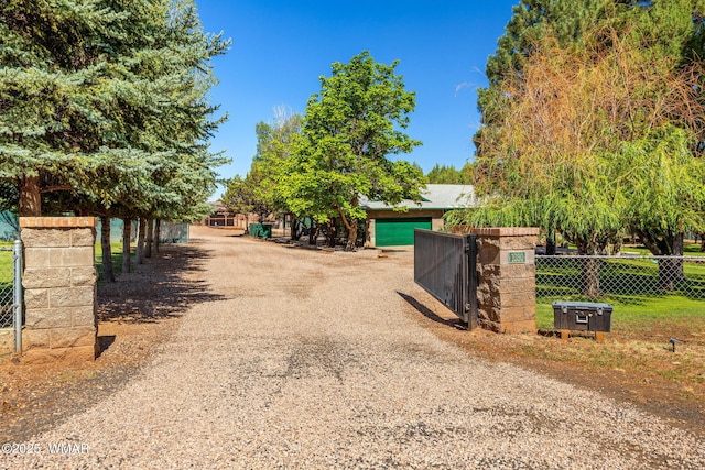 1030 Chamberlain Way, Show Low, AZ 85901 - view of dirt / gravel driveway featuring a gated entry