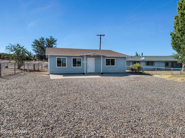 ranch-style home featuring fence private yard and a patio