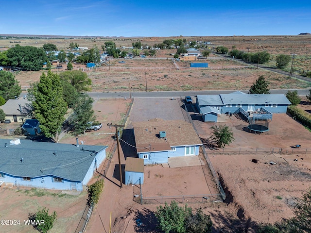 birds eye view of property with a rural view