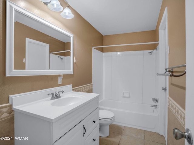 full bath with tile patterned flooring, shower / bathing tub combination, vanity, and toilet