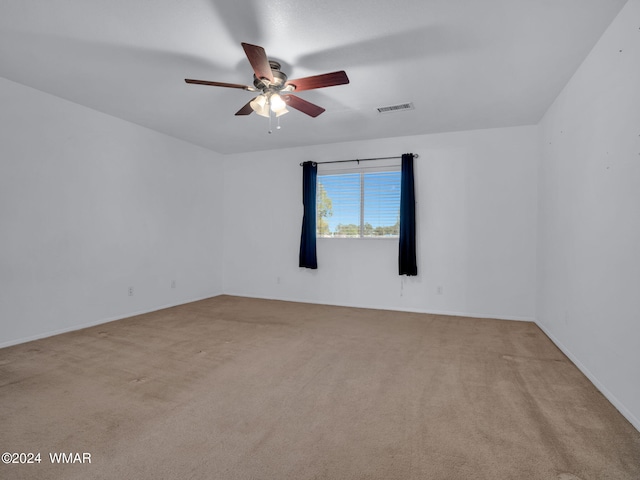 unfurnished room with light carpet, ceiling fan, and visible vents