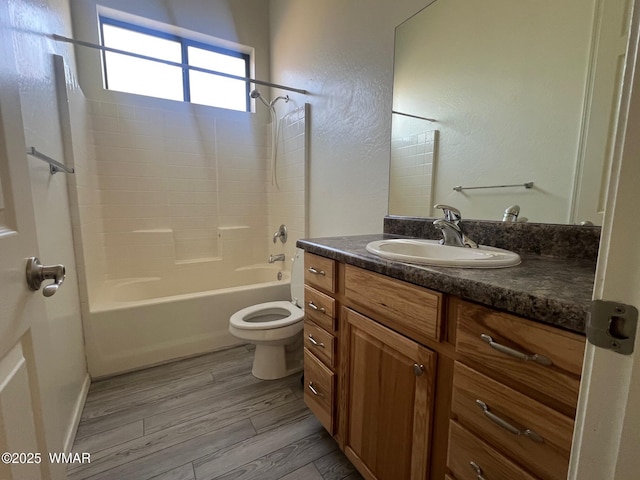 420 Washington St, Snowflake, AZ 85937 - bathroom with toilet, wood finished floors, vanity, and bathing tub / shower combination