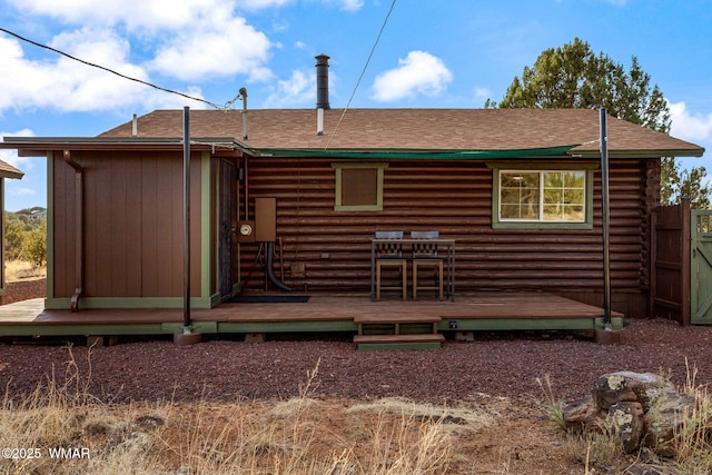 1919 Daggs St, Show Low, AZ 85901 - back of house featuring log exterior, a wooden deck, and a shingled roof