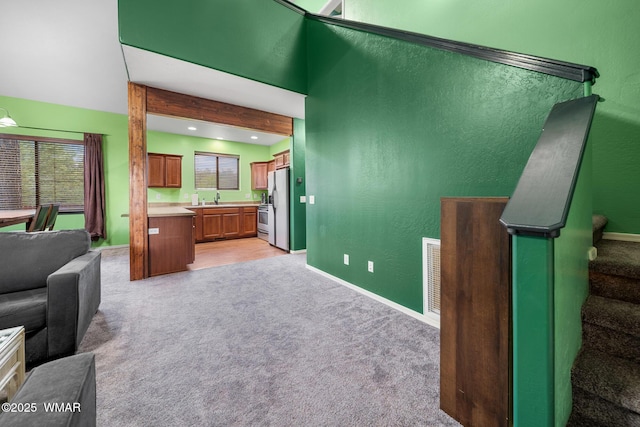 242 E Pinecrest Dr, Pinetop, AZ 85935 - living area with light carpet, baseboards, stairway, a textured wall, and recessed lighting