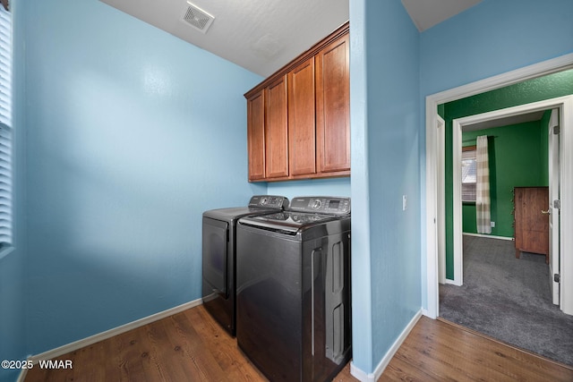 242 E Pinecrest Dr, Pinetop, AZ 85935 - laundry room featuring washing machine and dryer, cabinet space, baseboards, and dark wood-type flooring