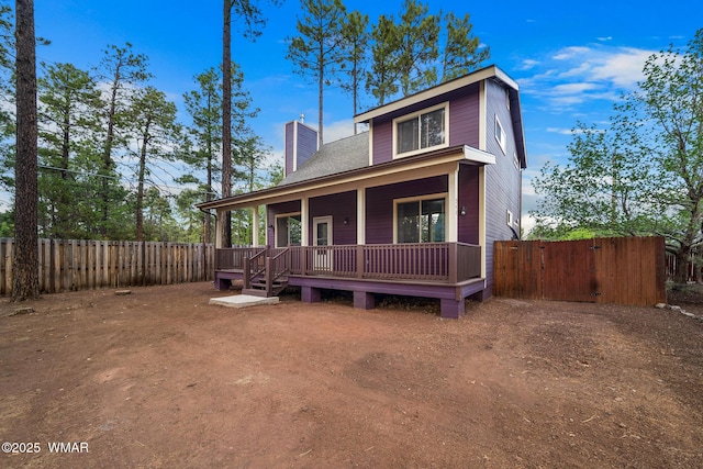 242 E Pinecrest Dr, Pinetop, AZ 85935 - view of front of house featuring a chimney, a fenced backyard, a deck, and a gate