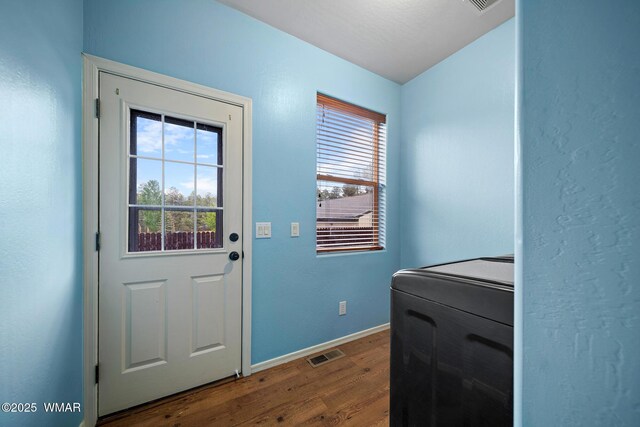 242 E Pinecrest Dr, Pinetop, AZ 85935 - laundry room with dark wood-style flooring and baseboards