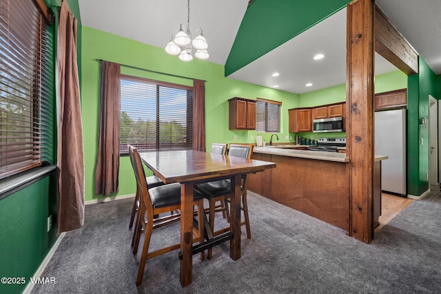 242 E Pinecrest Dr, Pinetop, AZ 85935 - dining room featuring a chandelier, carpet floors, lofted ceiling, recessed lighting, and baseboards
