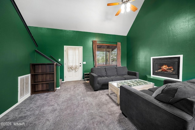 242 E Pinecrest Dr, Pinetop, AZ 85935 - living room featuring ceiling fan, high vaulted ceiling, carpet floors, and a warm lit fireplace