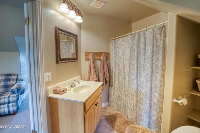 bathroom featuring visible vents and vanity