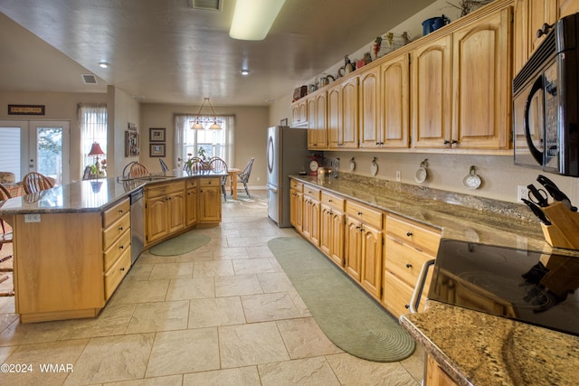 kitchen with a center island with sink, appliances with stainless steel finishes, a kitchen breakfast bar, french doors, and stone counters