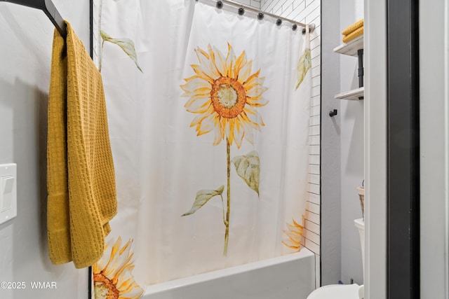 bathroom with shower / bath combination with curtain and toilet