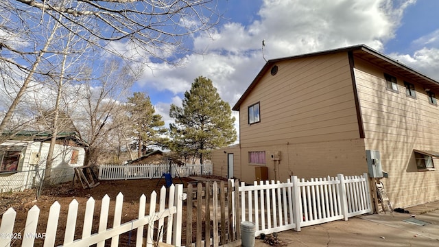 view of side of property featuring fence private yard