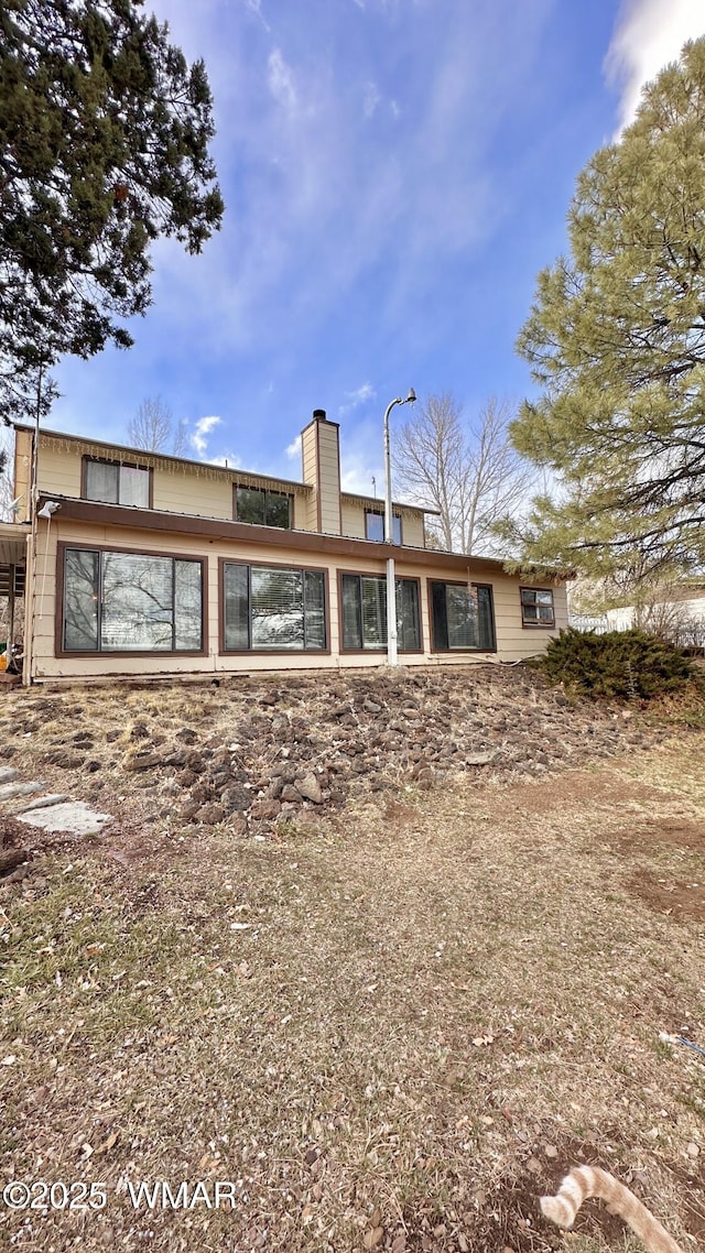 rear view of house with a chimney