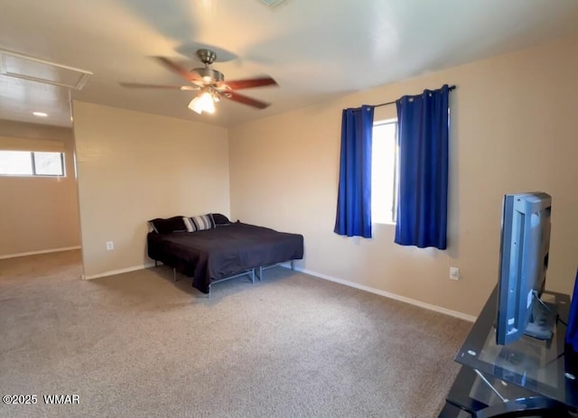 bedroom featuring ceiling fan, carpet flooring, attic access, and baseboards