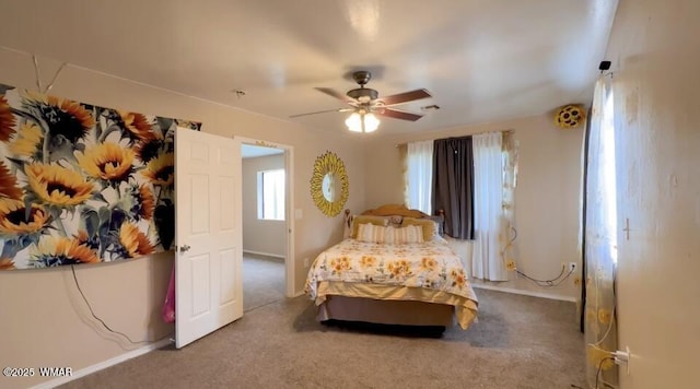 carpeted bedroom with visible vents and a ceiling fan