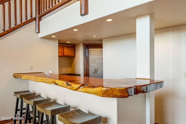 bar featuring recessed lighting and wet bar
