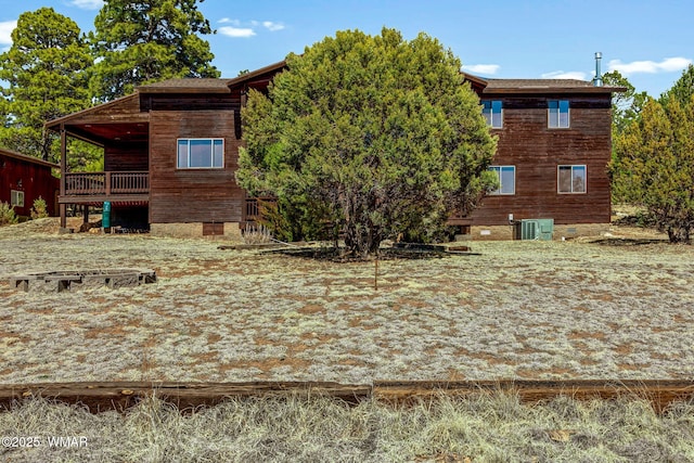 back of property with central AC