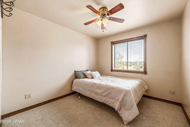 carpeted bedroom with baseboards and ceiling fan