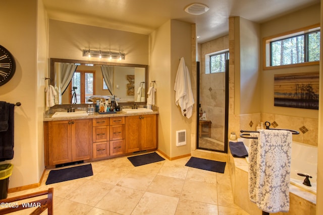 2841 Ponderosa Pkwy, Pinetop, AZ 85935 - full bathroom featuring plenty of natural light, double vanity, a bath, and tile patterned flooring