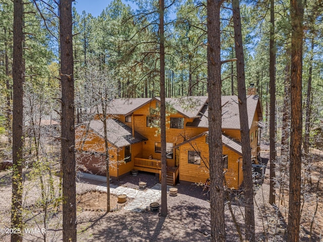 2841 Ponderosa Pkwy, Pinetop, AZ 85935 - back of house with a shingled roof, a deck, and a chimney