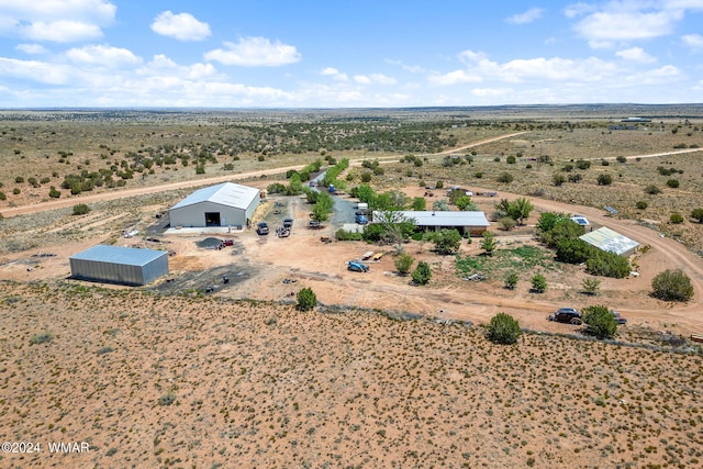 birds eye view of property featuring a rural view