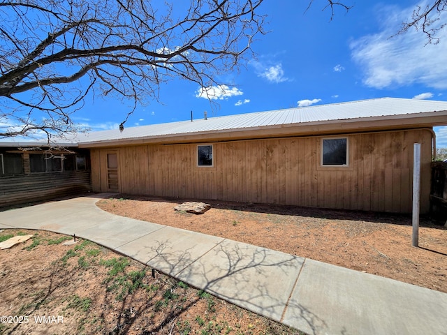 view of home's exterior featuring metal roof