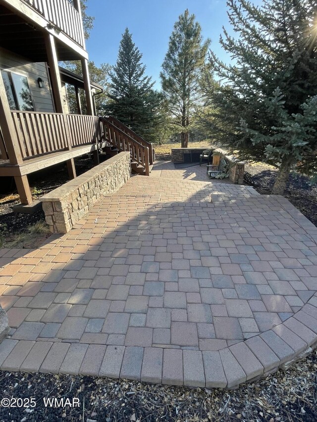 2321 Chandelle Ln, Overgaard, AZ 85933 - view of patio / terrace with a wooden deck and stairway
