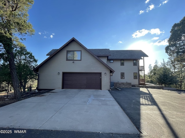 2321 Chandelle Ln, Overgaard, AZ 85933 - view of front of property with driveway, a garage, and roof with shingles