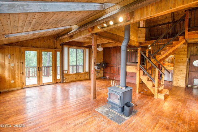 1144 Christopher Creek Loop, Payson, AZ 85541 - unfurnished living room featuring a wood stove, wooden walls, french doors, wood finished floors, and wooden ceiling
