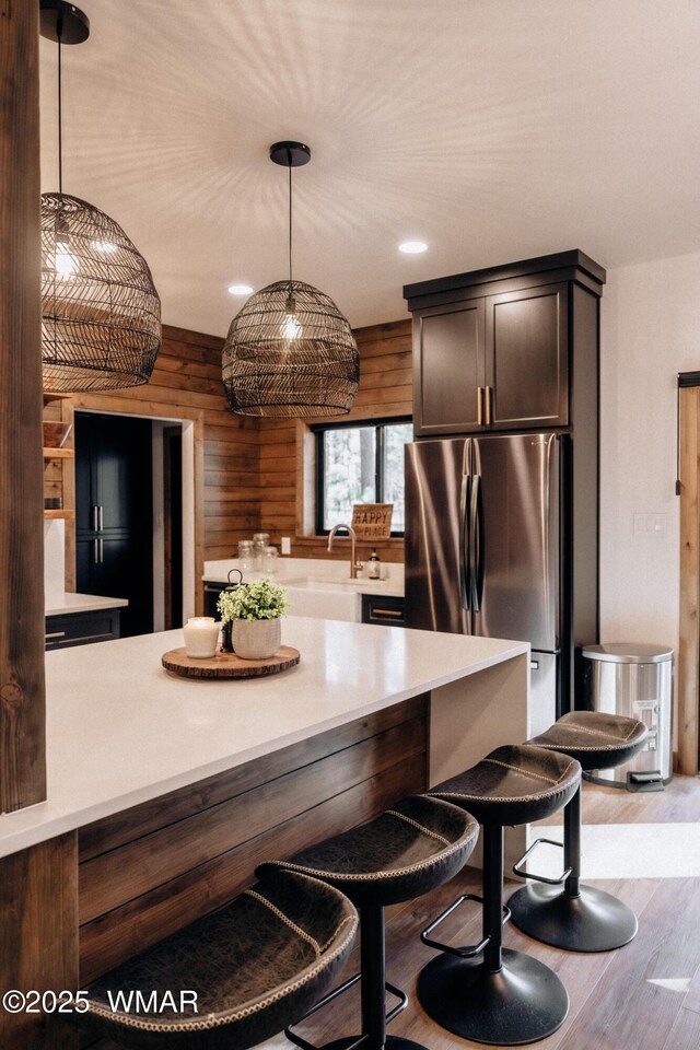4251 Branding Iron Loop, Pinetop, AZ 85935 - kitchen with freestanding refrigerator, wood finished floors, light countertops, hanging light fixtures, and recessed lighting