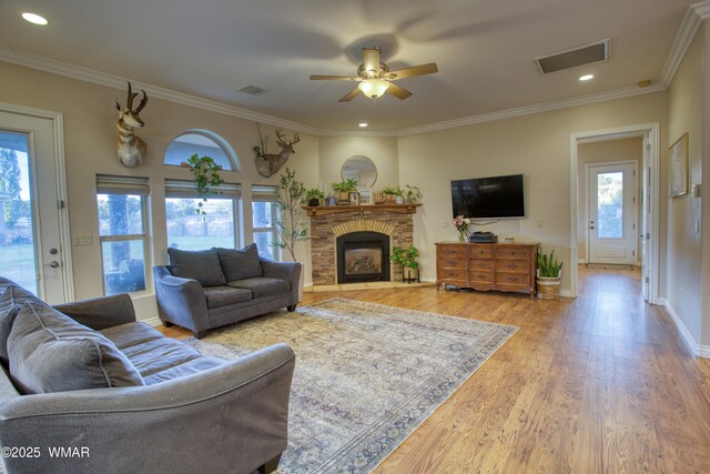 7444 Caldwell Canyon Rd, Snowflake, AZ 85937 - living area featuring plenty of natural light, ceiling fan, a fireplace, wood finished floors, and recessed lighting